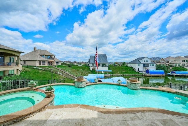 12590 St Ann Ct, Willis, TX 77318 - view of pool featuring a residential view and a pool with connected hot tub