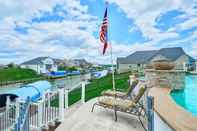 12590 St Ann Ct, Willis, TX 77318 - view of patio / terrace with a residential view and a water view