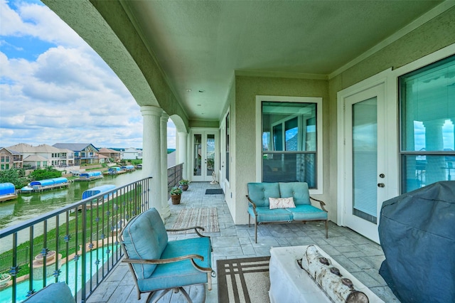 12590 St Ann Ct, Willis, TX 77318 - balcony featuring french doors, outdoor lounge area, area for grilling, a water view, and a residential view