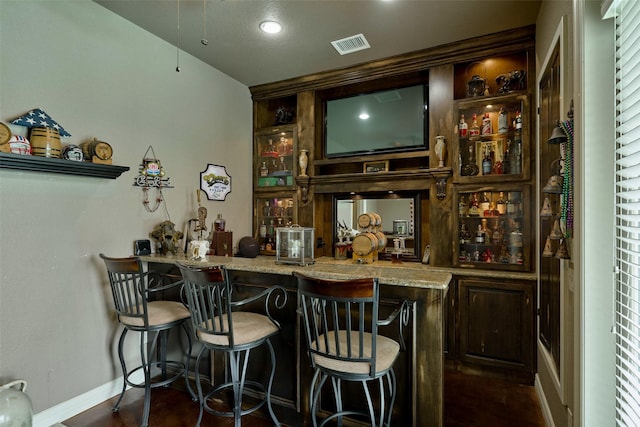 12590 St Ann Ct, Willis, TX 77318 - indoor wet bar featuring baseboards