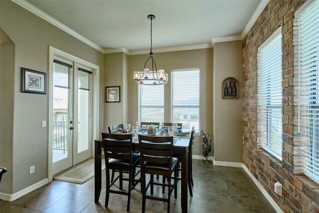 12590 St Ann Ct, Willis, TX 77318 - dining room with crown molding, baseboards, a chandelier, brick wall, and french doors