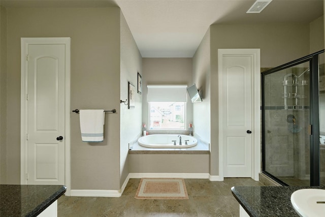 12590 St Ann Ct, Willis, TX 77318 - full bath featuring vanity, a stall shower, a bath, and baseboards