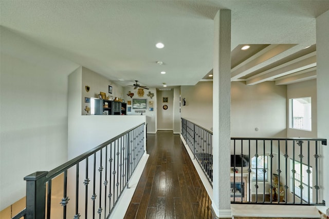 12590 St Ann Ct, Willis, TX 77318 - hallway with hardwood / wood-style flooring, recessed lighting, a textured ceiling, baseboards, and an upstairs landing