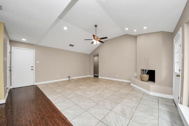 2026 Hickory Glen Dr, Missouri City, TX 77489 - unfurnished living room featuring ceiling fan, recessed lighting, vaulted ceiling, baseboards, and light wood-style floors