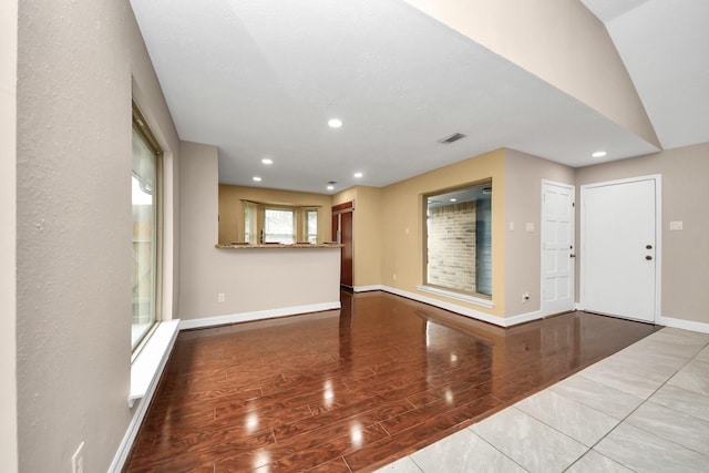 2026 Hickory Glen Dr, Missouri City, TX 77489 - unfurnished living room with wood finished floors, baseboards, and recessed lighting