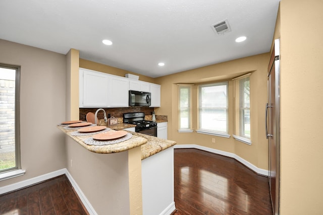 2026 Hickory Glen Dr, Missouri City, TX 77489 - kitchen with black appliances, baseboards, white cabinets, dark wood finished floors, and recessed lighting