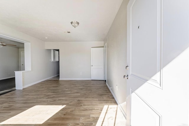 4637 Carmen St, Houston, TX 77051 - empty room featuring light wood-style floors, baseboards, and ceiling fan