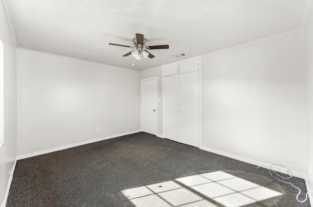 4637 Carmen St, Houston, TX 77051 - unfurnished bedroom featuring dark colored carpet, baseboards, ceiling fan, and a closet