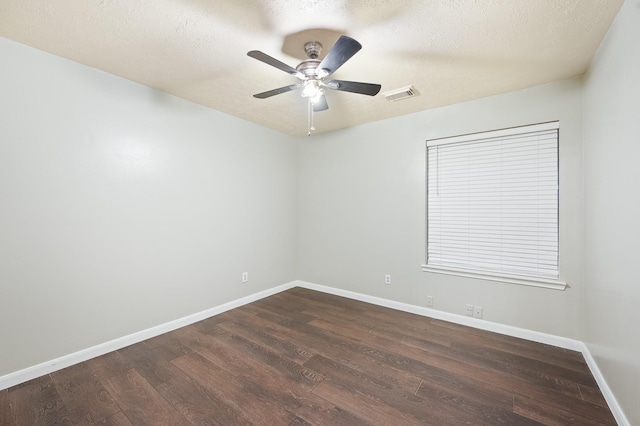 7624 Lone Meadow Ct, Houston, TX 77095 - spare room with dark wood-style flooring, baseboards, ceiling fan, and a textured ceiling