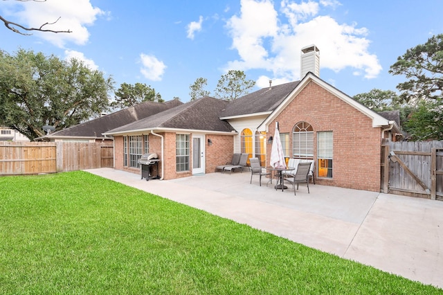 7624 Lone Meadow Ct, Houston, TX 77095 - rear view of house with brick siding, a patio area, a chimney, and a shingled roof