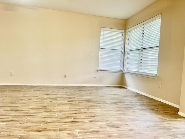 2711 Grants Lake Blvd Unit 203, Sugar Land, TX 77479 - unfurnished room featuring baseboards and wood finished floors