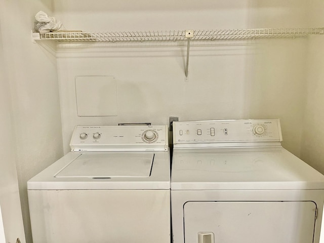 2711 Grants Lake Blvd Unit 203, Sugar Land, TX 77479 - washroom featuring independent washer and dryer