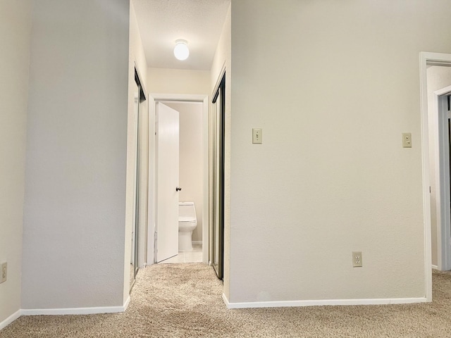 2711 Grants Lake Blvd Unit 203, Sugar Land, TX 77479 - hall with carpet flooring and baseboards