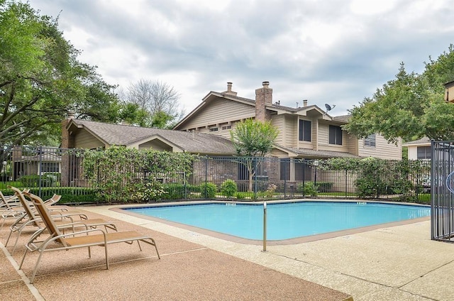2711 Grants Lake Blvd Unit 203, Sugar Land, TX 77479 - community pool with fence and a patio