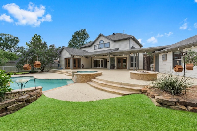 back of house with french doors, an outdoor fire pit, a patio area, and fence