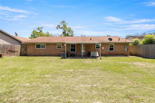 back of house with a patio area, brick siding, a gate, and cooling unit