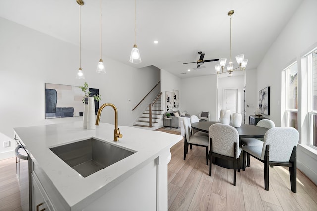 7117 Goforth St, Houston, TX 77021 - kitchen with a sink, light wood-style flooring, healthy amount of natural light, and recessed lighting