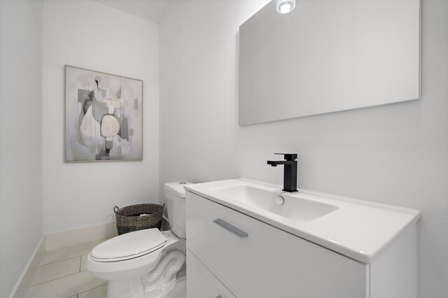 7117 Goforth St, Houston, TX 77021 - half bathroom featuring toilet, vanity, baseboards, and tile patterned floors