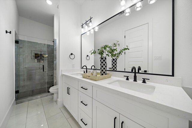 7117 Goforth St, Houston, TX 77021 - bathroom featuring toilet, a stall shower, tile patterned flooring, double vanity, and baseboards