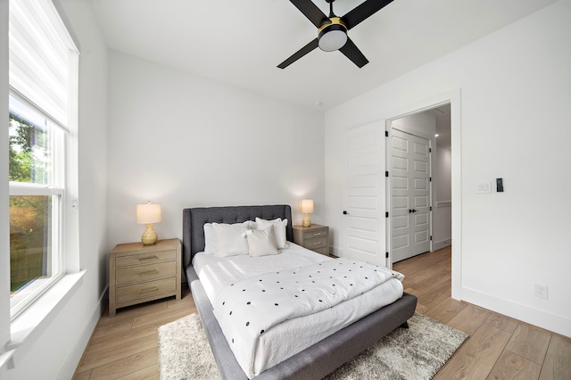 7117 Goforth St, Houston, TX 77021 - bedroom featuring light wood-type flooring, baseboards, and a ceiling fan