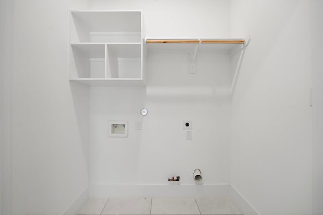 7117 Goforth St, Houston, TX 77021 - clothes washing area with hookup for a gas dryer, hookup for an electric dryer, hookup for a washing machine, tile patterned floors, and baseboards