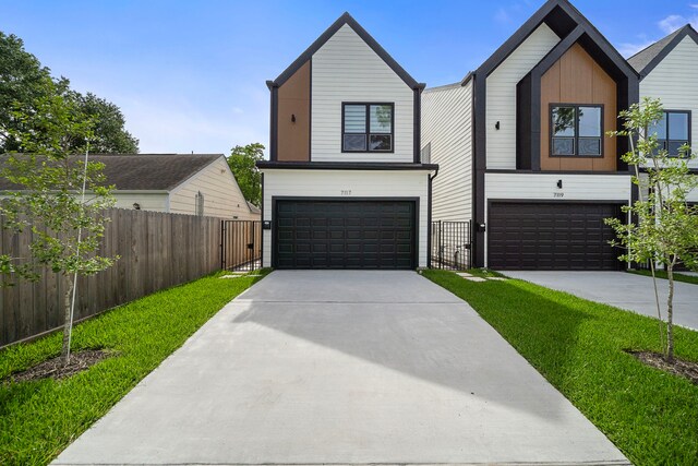 7117 Goforth St, Houston, TX 77021 - view of front of property with a garage and driveway