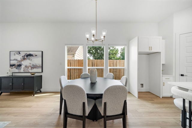7117 Goforth St, Houston, TX 77021 - dining room with a chandelier and light wood finished floors
