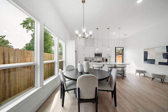 7117 Goforth St, Houston, TX 77021 - dining space featuring plenty of natural light, a chandelier, recessed lighting, and light wood-type flooring