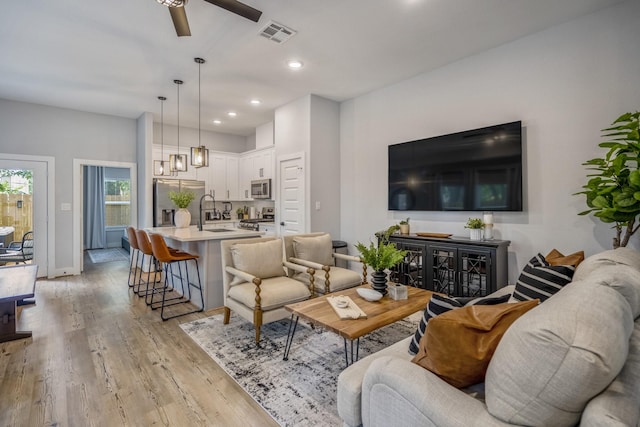 3710 Noah St, Houston, TX 77021 - living room featuring a ceiling fan, light wood-style flooring, recessed lighting, and baseboards