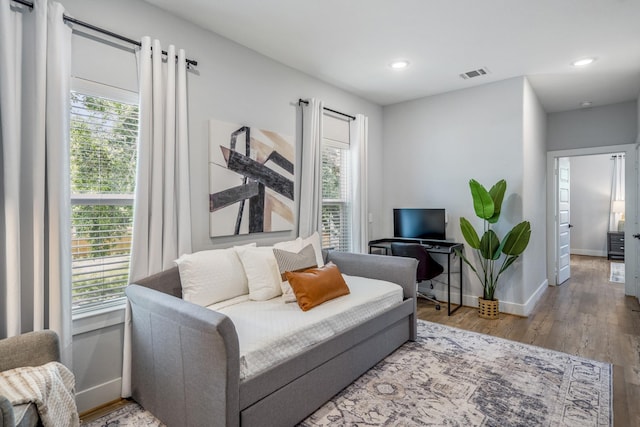 3710 Noah St, Houston, TX 77021 - living area with wood finished floors, baseboards, and recessed lighting
