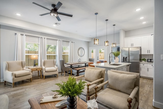 3710 Noah St, Houston, TX 77021 - living room featuring light wood finished floors, ceiling fan, recessed lighting, and french doors