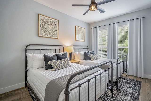 3710 Noah St, Houston, TX 77021 - bedroom with baseboards, wood finished floors, and ceiling fan