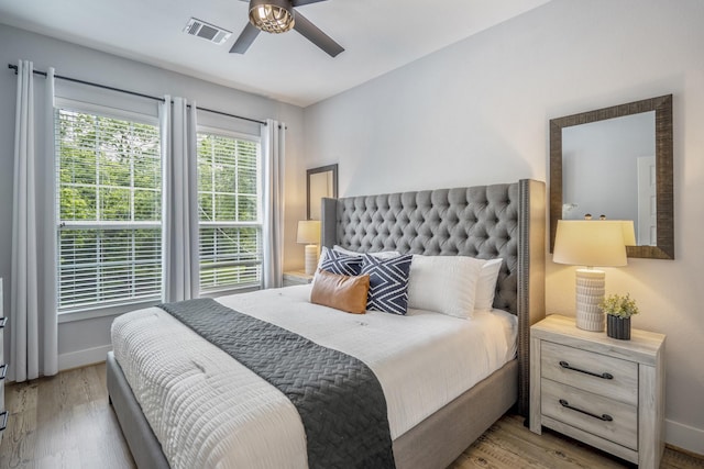 3710 Noah St, Houston, TX 77021 - bedroom with wood finished floors, baseboards, and ceiling fan