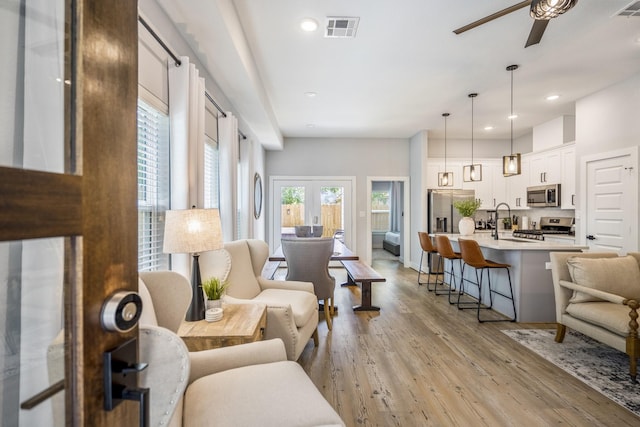 3710 Noah St, Houston, TX 77021 - living area with a ceiling fan, light wood-style floors, and recessed lighting