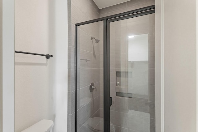67 Quiet Vista Dr, Sugar Land, TX 77498 - full bathroom featuring toilet and a stall shower