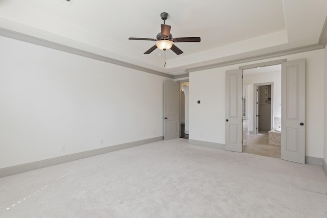 67 Quiet Vista Dr, Sugar Land, TX 77498 - unfurnished bedroom with light carpet, a tray ceiling, baseboards, and ceiling fan