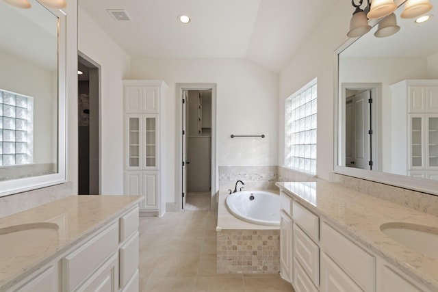 67 Quiet Vista Dr, Sugar Land, TX 77498 - bathroom with tile patterned flooring, a garden tub, two vanities, a chandelier, and recessed lighting