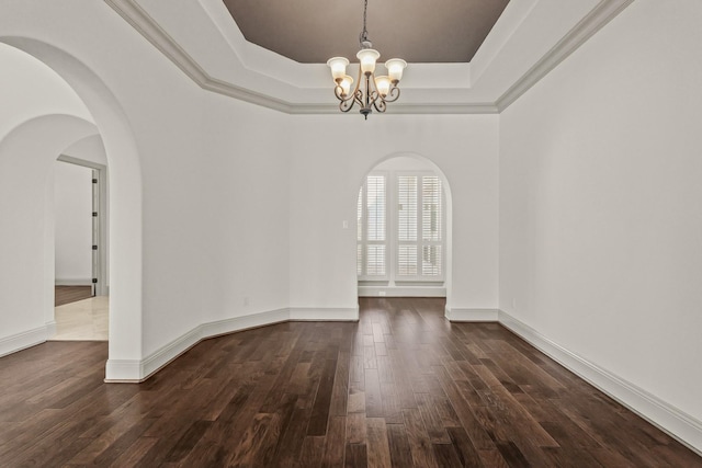67 Quiet Vista Dr, Sugar Land, TX 77498 - unfurnished dining area featuring a chandelier, a raised ceiling, dark wood-style flooring, arched walkways, and baseboards