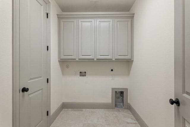 67 Quiet Vista Dr, Sugar Land, TX 77498 - laundry room featuring hookup for an electric dryer, baseboards, washer hookup, and cabinet space