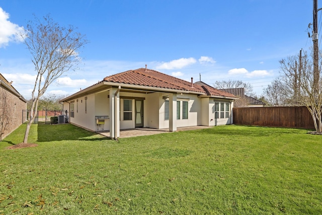 67 Quiet Vista Dr, Sugar Land, TX 77498 - back of property featuring a tile roof, a patio area, and stucco siding