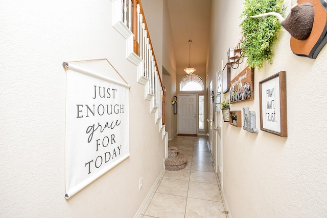 12513 Canyon Hill Dr, Willis, TX 77318 - corridor with light tile patterned floors, baseboards, and a towering ceiling