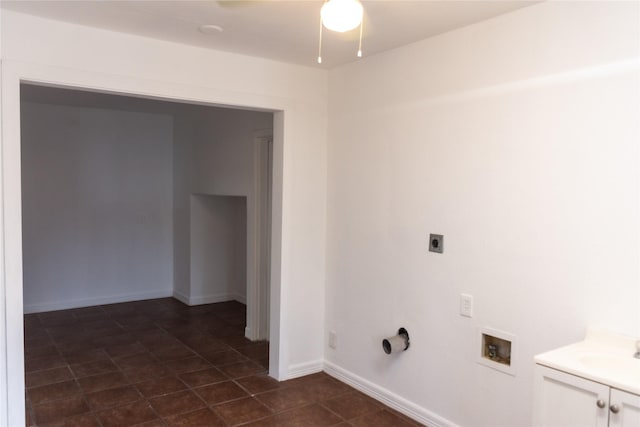 5311 Perry Ave, Galveston, TX 77551 - clothes washing area with electric dryer hookup, cabinet space, a ceiling fan, hookup for a washing machine, and dark tile patterned floors