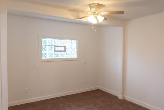 5311 Perry Ave, Galveston, TX 77551 - unfurnished room featuring a ceiling fan and baseboards