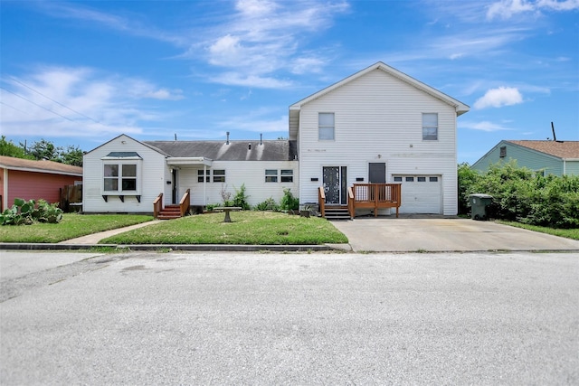 5311 Perry Ave, Galveston, TX 77551 - traditional home with an attached garage, concrete driveway, and a front lawn