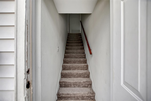 5311 Perry Ave, Galveston, TX 77551 - stairway with baseboards and a textured wall