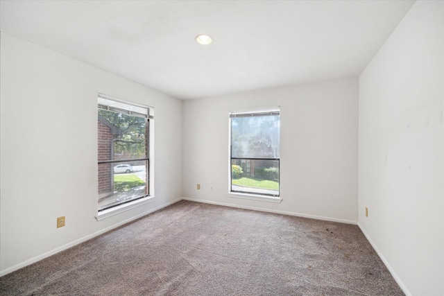 7447 Cambridge St Unit 75, Houston, TX 77054 - carpeted empty room with baseboards and recessed lighting