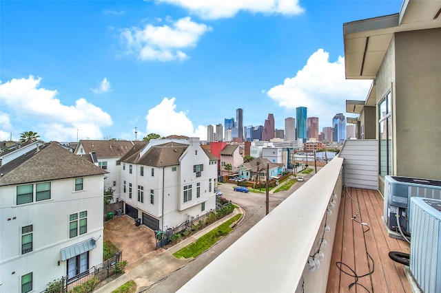 balcony featuring cooling unit and a view of skyline