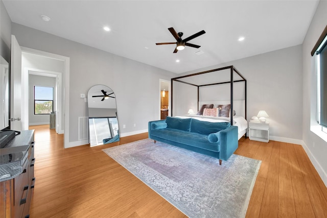 bedroom featuring light wood-style floors, baseboards, recessed lighting, and ceiling fan