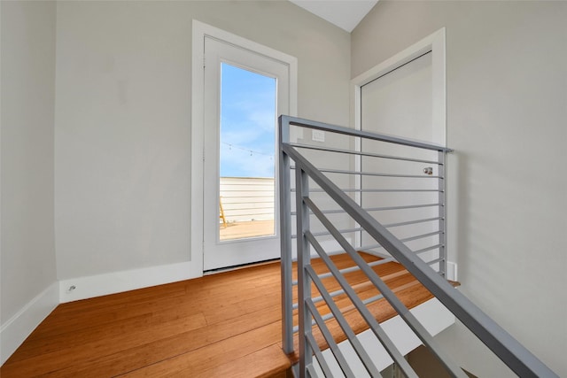 staircase with wood finished floors