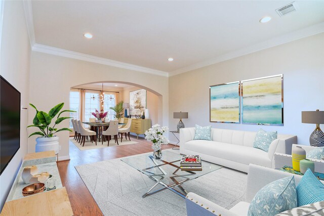 3628 Timberside Circle Dr, Houston, TX 77025 - living area with arched walkways, wood finished floors, ornamental molding, recessed lighting, and baseboards
